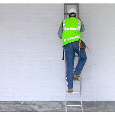 Man climbing red ladder